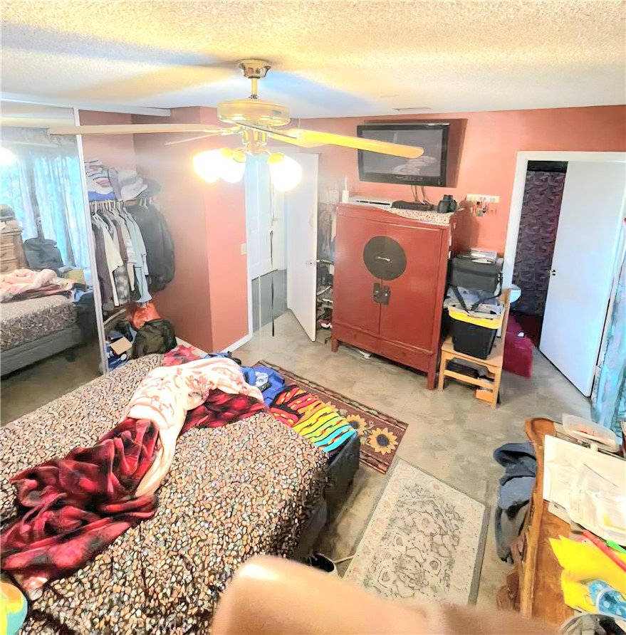 4267 Baggett Drive Riverside, CA 92505 - Photo 21 of 28 a bedroom with a bed and a lamp with the dresser