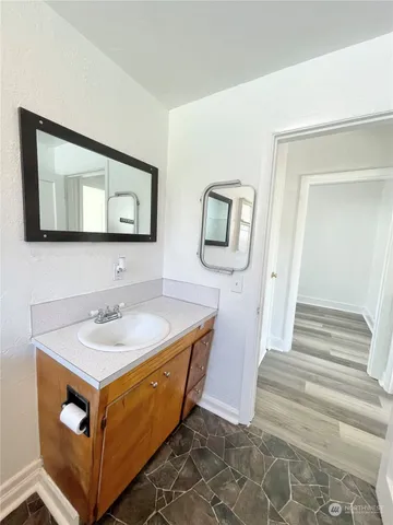 a bathroom with a sink and a mirror
