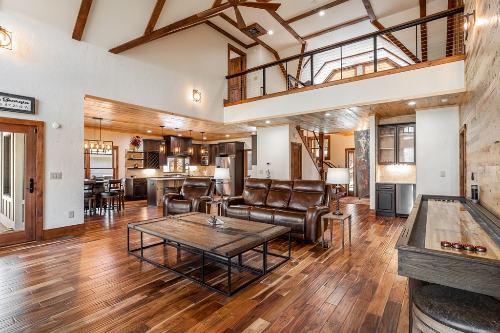 1248 Sunset Road Epworth, GA 30541 - Photo 15 of 65 a living room with furniture a wooden floor and next to a window
