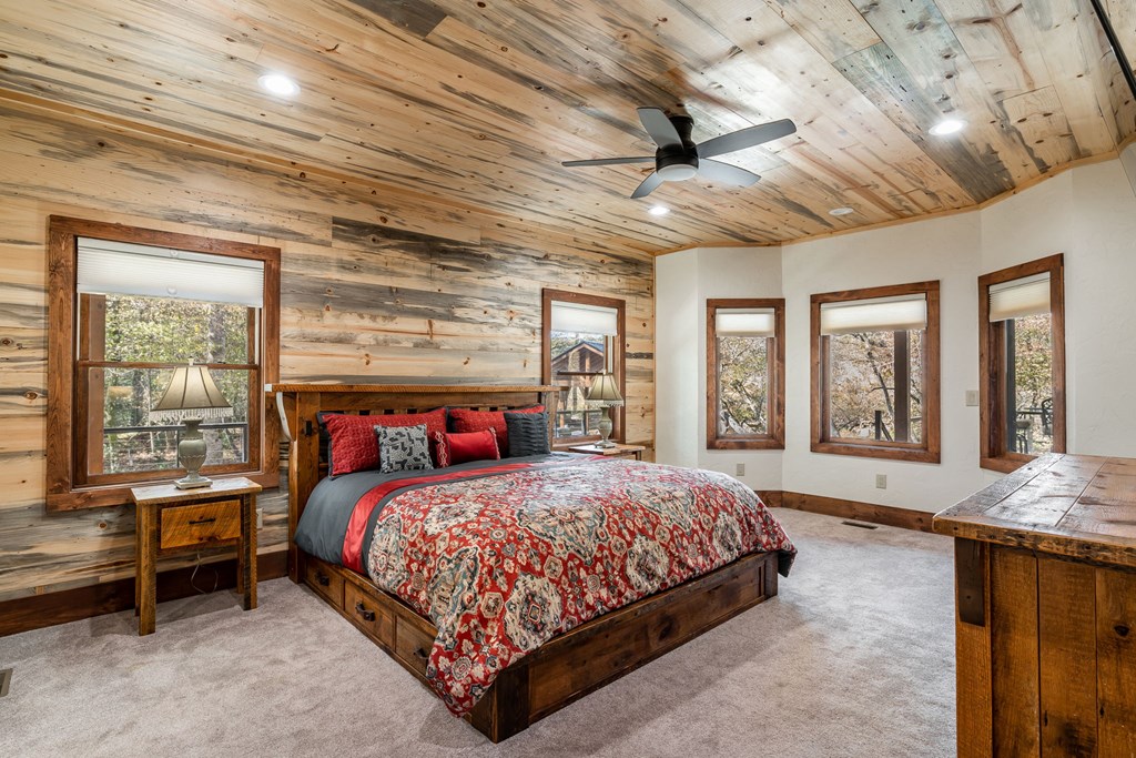 1248 Sunset Road Epworth, GA 30541 - Photo 20 of 65 a bedroom with a large bed and a large window