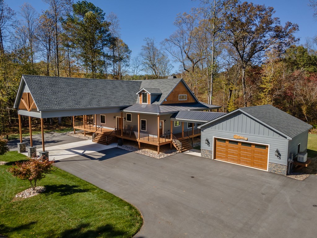 1248 Sunset Road Epworth, GA 30541 - Photo 2 of 65 a view of a house with a patio and a fire pit