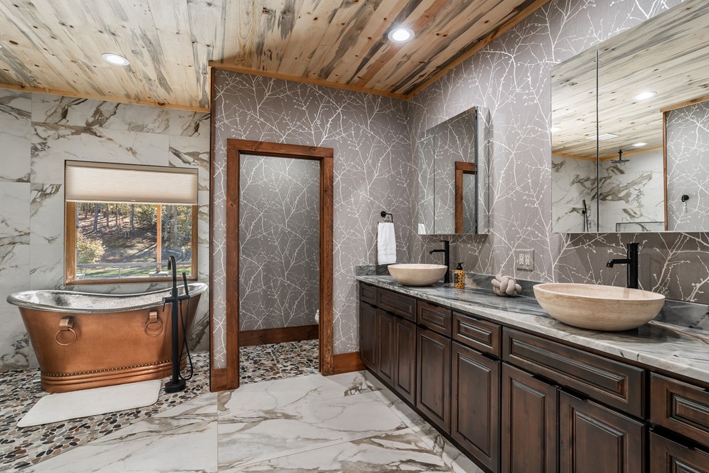 1248 Sunset Road Epworth, GA 30541 - Photo 22 of 65 a bathroom with a granite countertop sink a toilet and shower