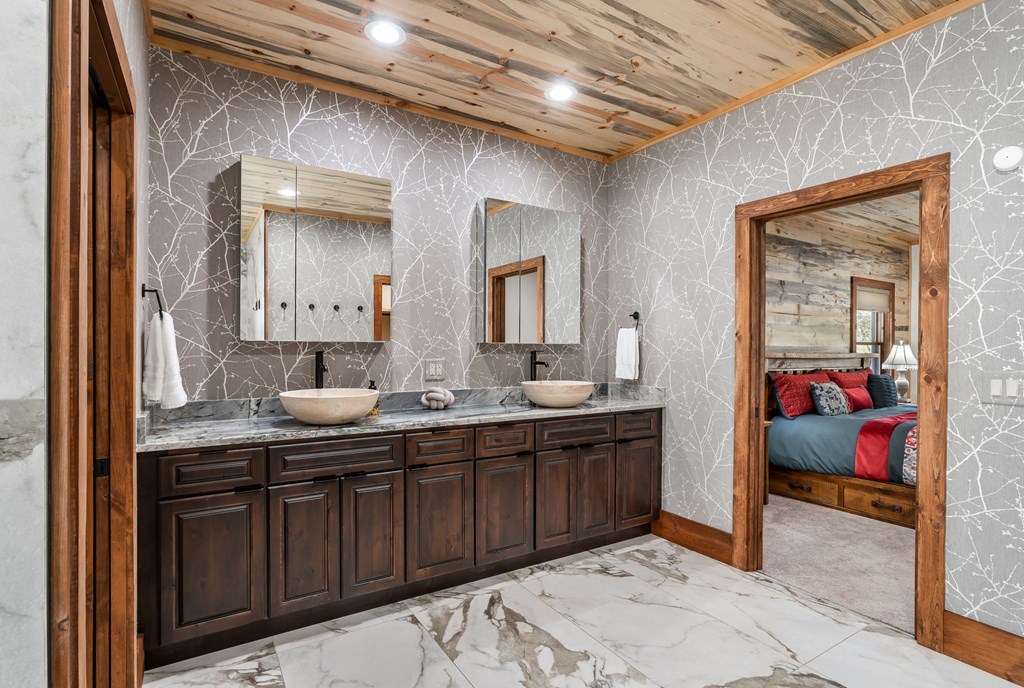 1248 Sunset Road Epworth, GA 30541 - Photo 25 of 65 a en suite bathroom with a double vanity sink and a mirror