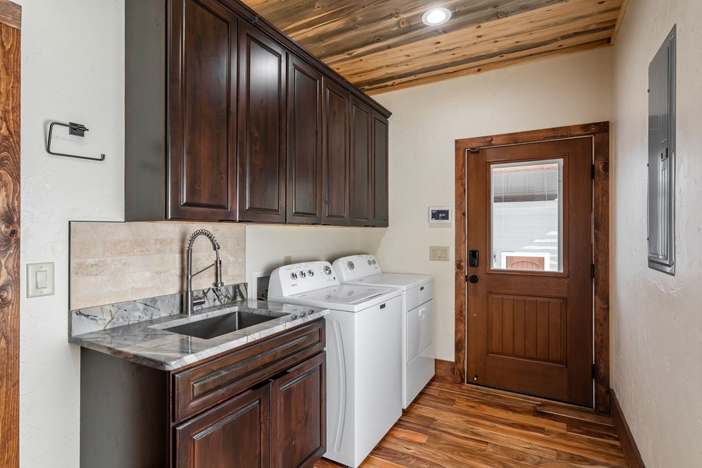 1248 Sunset Road Epworth, GA 30541 - Photo 28 of 65 a utility room with a sink a washer and dryer