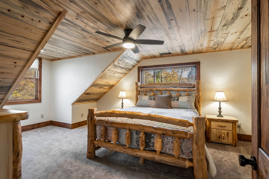 1248 Sunset Road Epworth, GA 30541 - Photo 36 of 65 a bedroom with furniture and a window