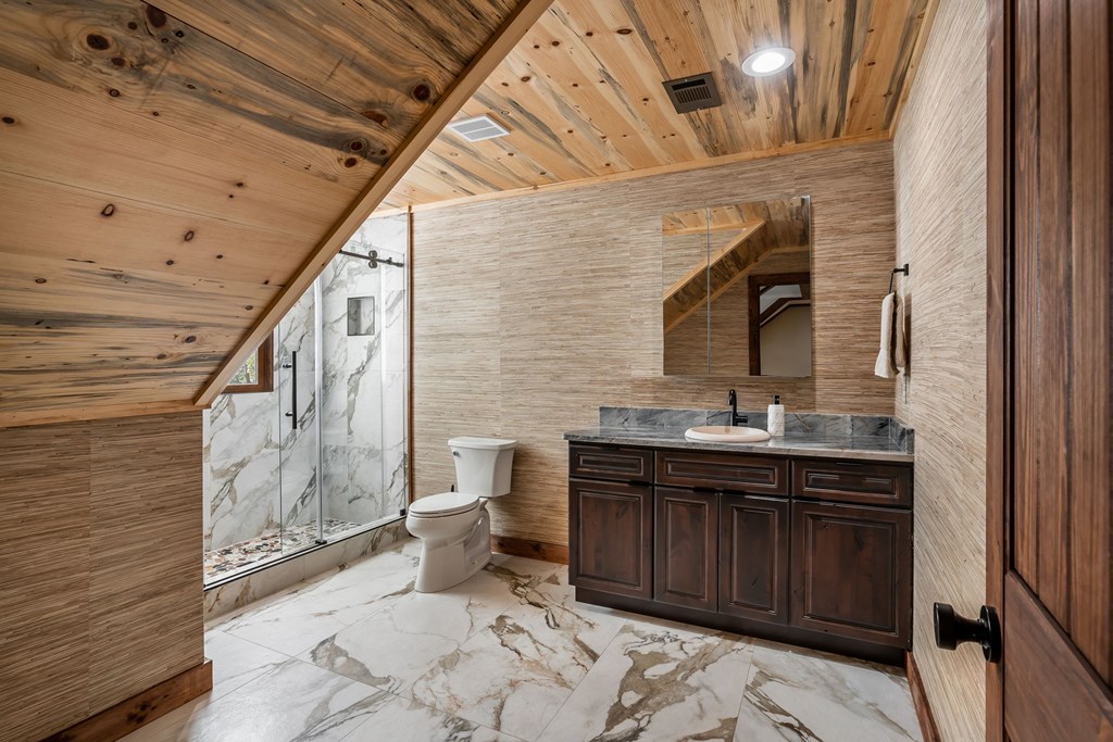 1248 Sunset Road Epworth, GA 30541 - Photo 40 of 65 a bathroom with a sink and mirror