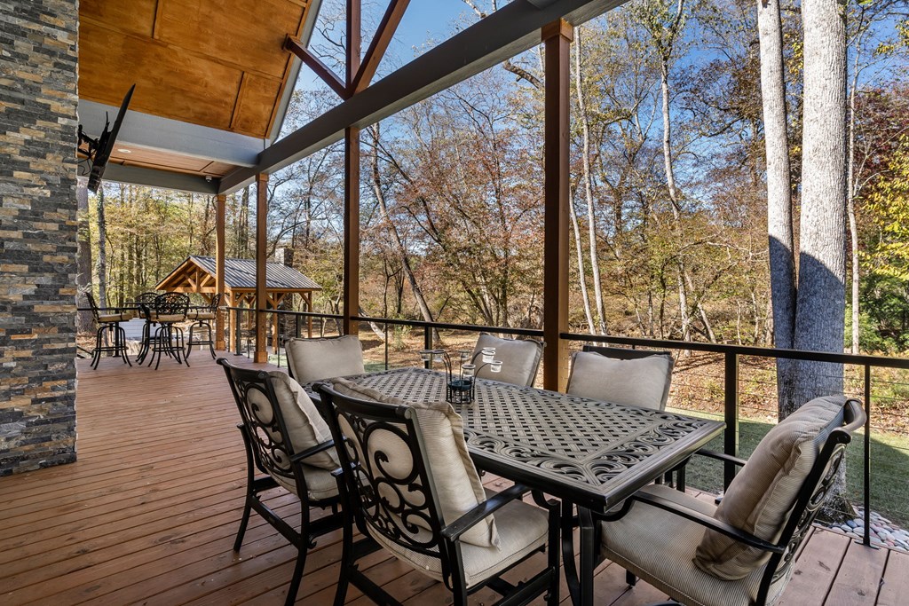 1248 Sunset Road Epworth, GA 30541 - Photo 42 of 65 a view of a patio with a table and chairs