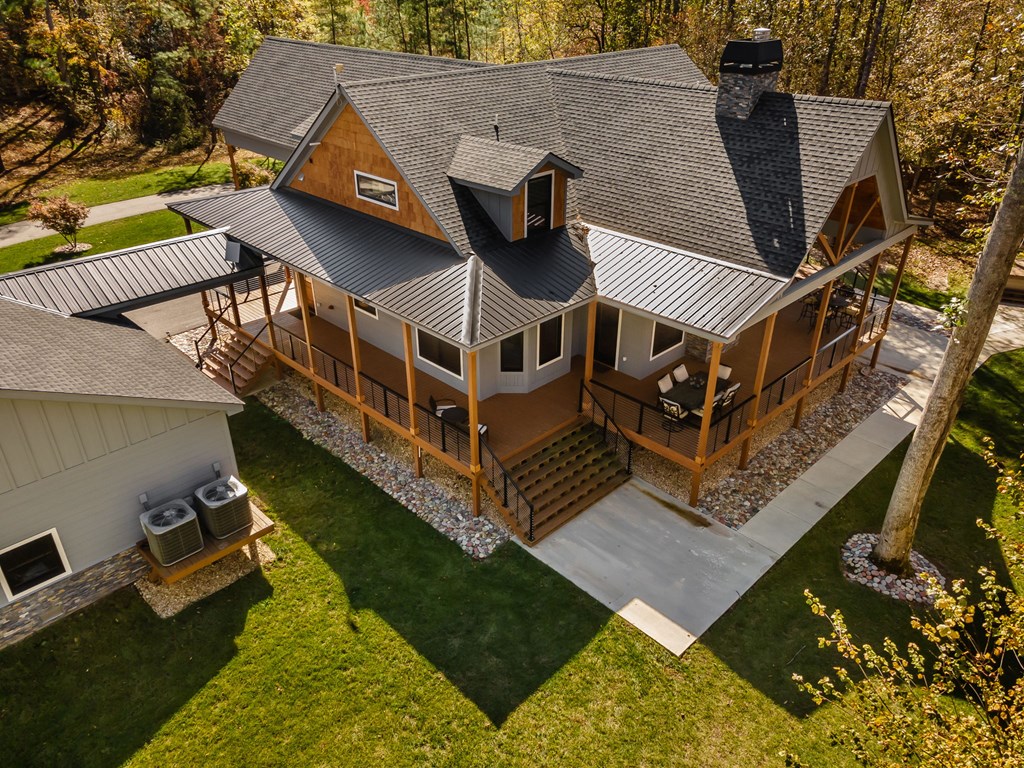 1248 Sunset Road Epworth, GA 30541 - Photo 6 of 65 a view of a house with pool and chairs