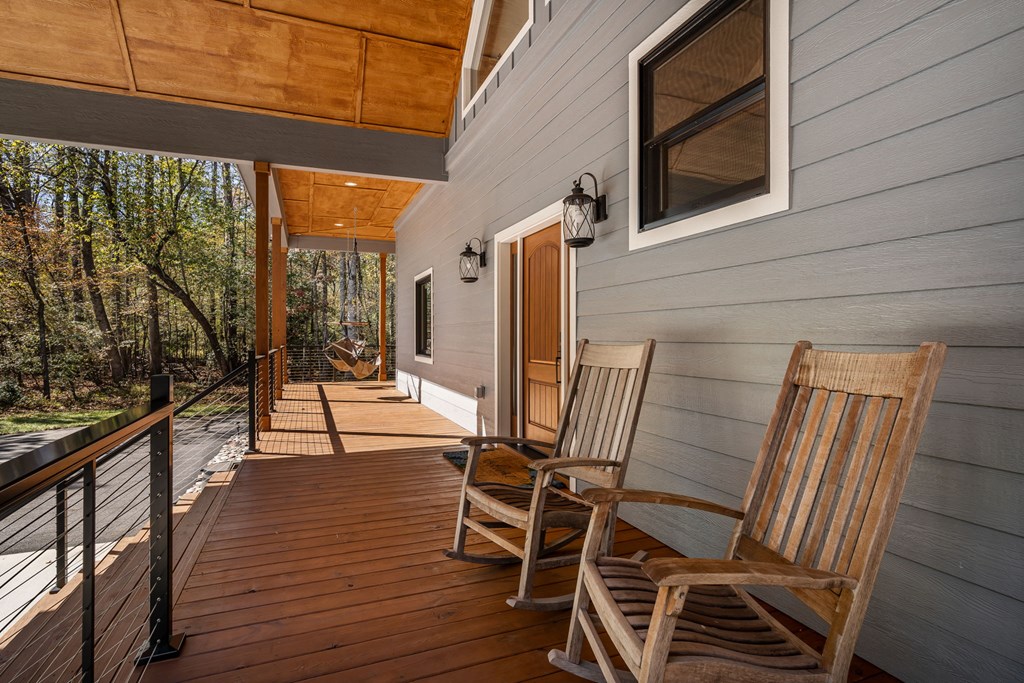 1248 Sunset Road Epworth, GA 30541 - Photo 63 of 65 a view of balcony with wooden floor and outdoor seating
