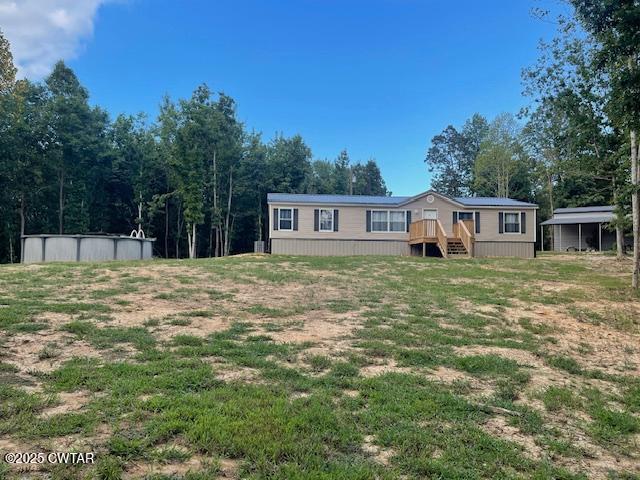 4555 Rue Hamner Road Cedar Grove, TN 38321 - Photo 3 of 45 a view of a house with a yard