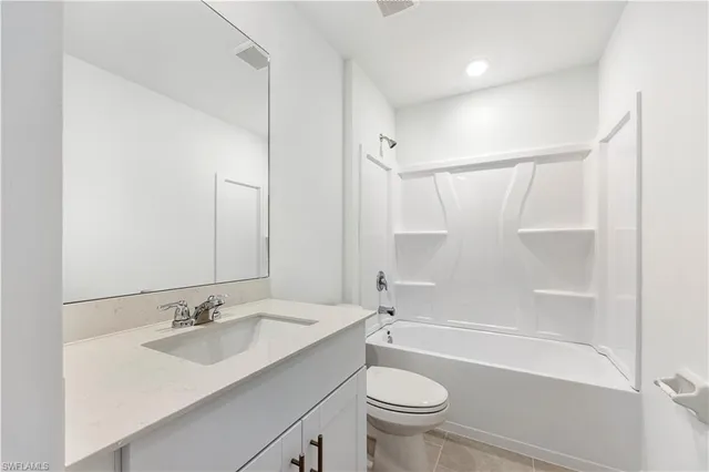 a bathroom with a sink a toilet and a bathtub