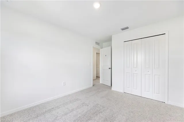 a view of an empty room and a window