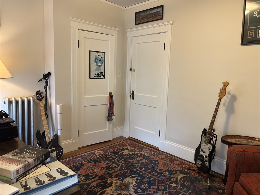 54-56 Farragut Avenue, Unit 2 Somerville, MA 02144 - Photo 19 of 30 a view of a bedroom with gym equipment