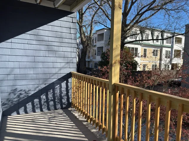 a view of a brick building from a balcony