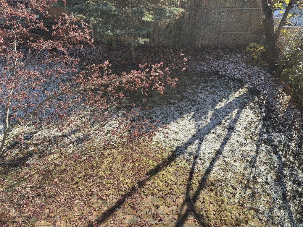 54-56 Farragut Avenue, Unit 2 Somerville, MA 02144 - Photo 30 of 30 a view of a wooden fence