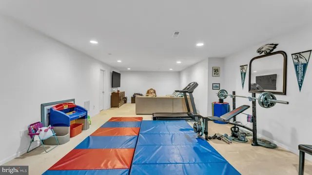 a room with lots of furniture and wooden floor