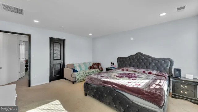 a bathroom with a sink vanity mirror and toilet