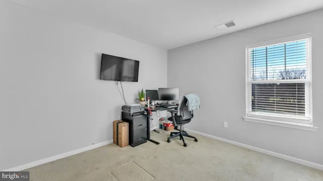 a bedroom with bed and a window