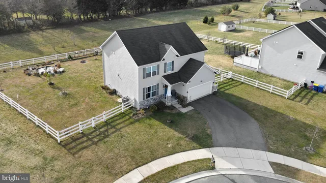 an aerial view of a house with a lake view