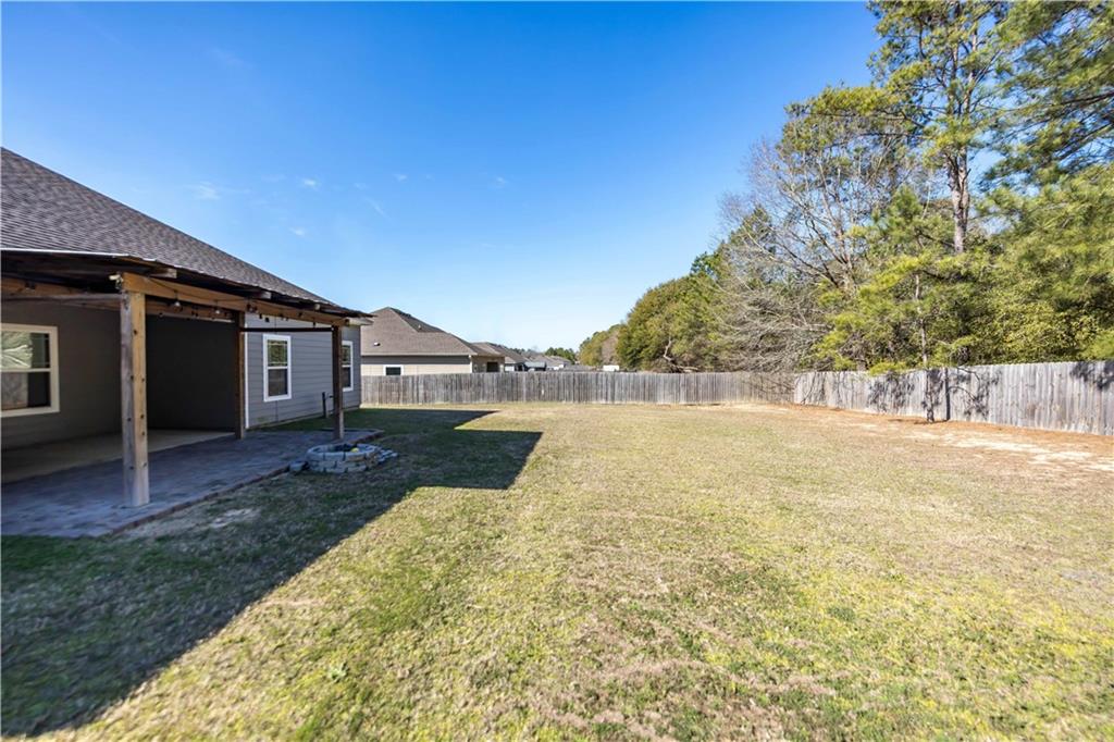 70 Apache Trail Fort Mitchell, AL 36856 - Photo 24 of 33 Fenced backyard with a patio