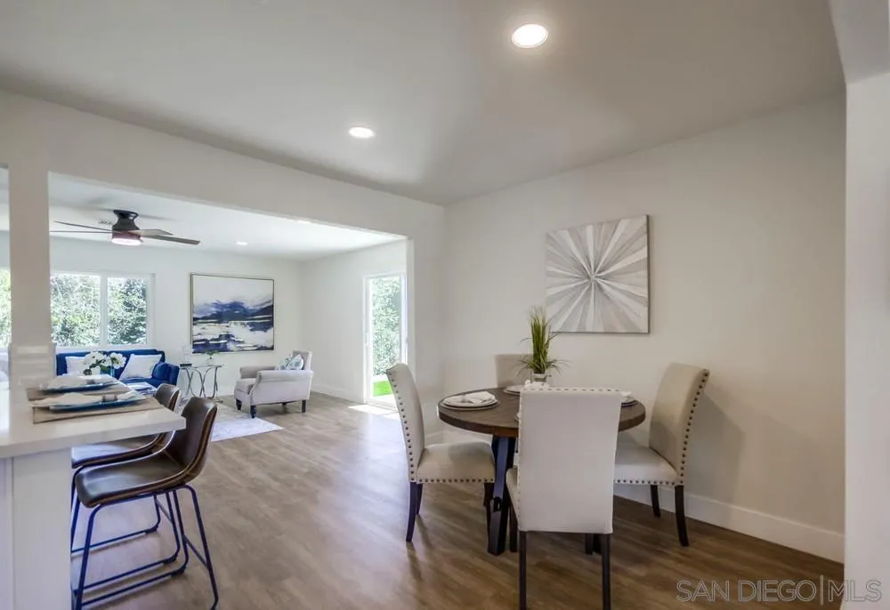 9841 Settle Road Santee, CA 92071 - Photo 11 of 46 a view of a dining room with furniture and wooden floor
