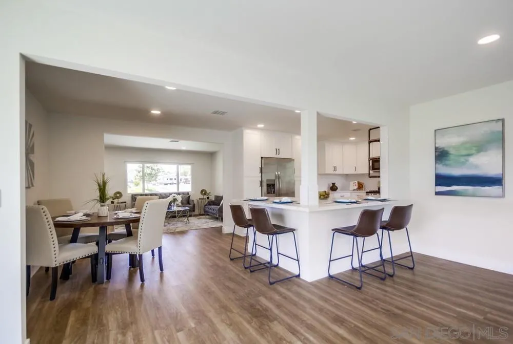 9841 Settle Road Santee, CA 92071 - Photo 13 of 46 a view of a dining room with furniture and wooden floor