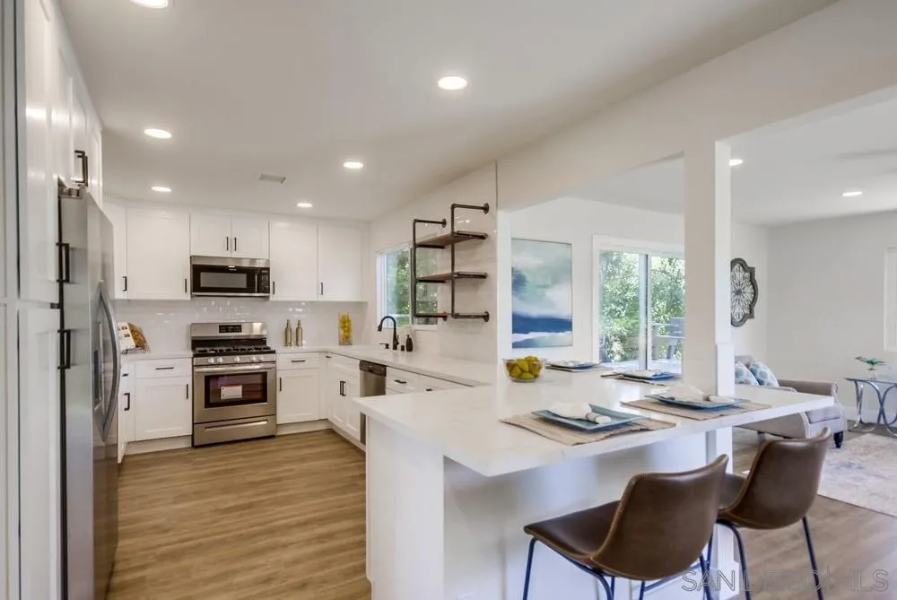 9841 Settle Road Santee, CA 92071 - Photo 20 of 46 a kitchen with a sink stove and refrigerator