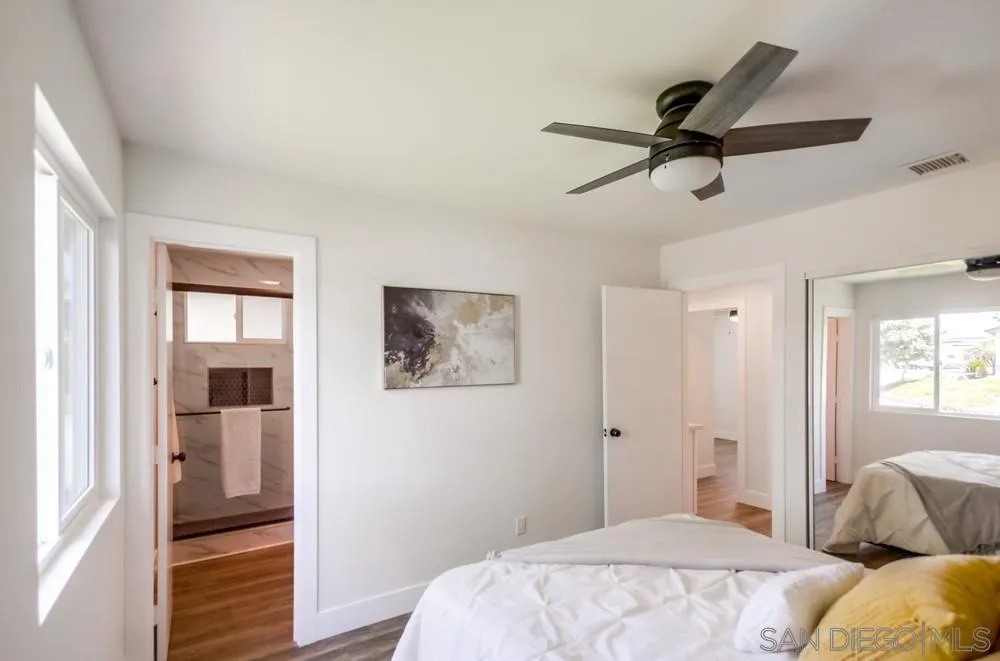 9841 Settle Road Santee, CA 92071 - Photo 29 of 46 a bedroom with a bed and a painting on the wall