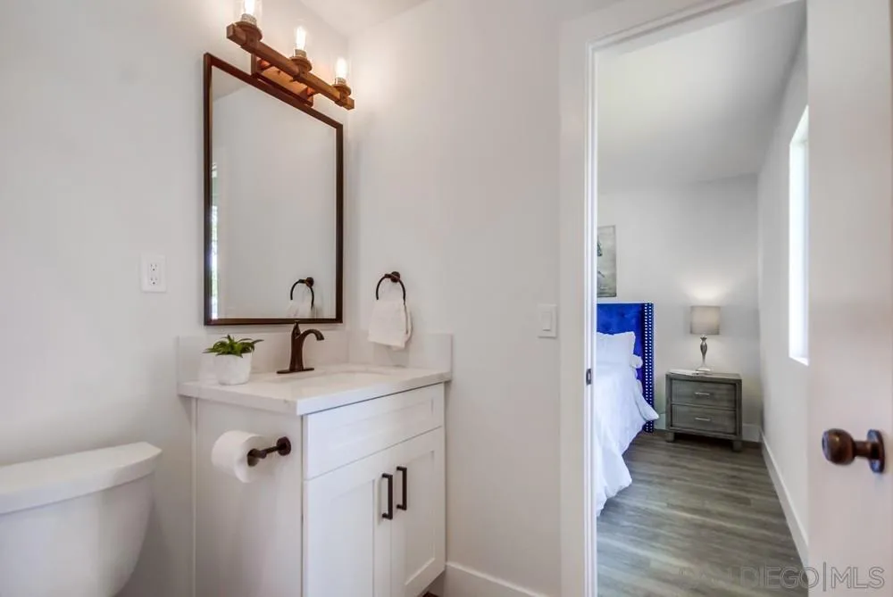9841 Settle Road Santee, CA 92071 - Photo 33 of 46 a bathroom with a sink and a mirror