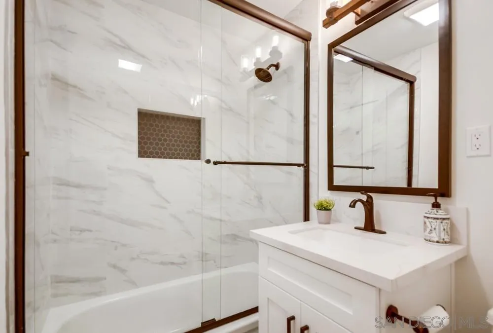 9841 Settle Road Santee, CA 92071 - Photo 37 of 46 a bathroom with a sink and a bathtub