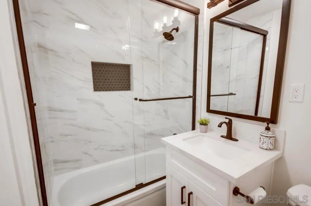 9841 Settle Road Santee, CA 92071 - Photo 38 of 46 a bathroom with a sink and a mirror