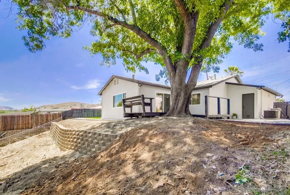 9841 Settle Road Santee, CA 92071 - Photo 41 of 46 a front view of a house with a yard and mountain view