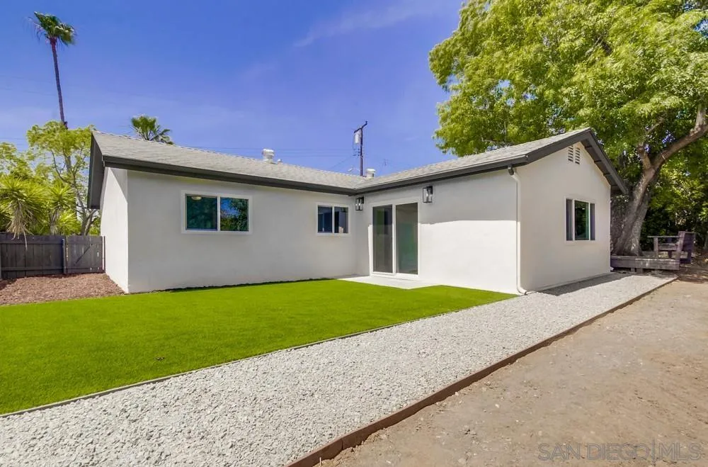 9841 Settle Road Santee, CA 92071 - Photo 43 of 46 a front view of a house with a yard and garage