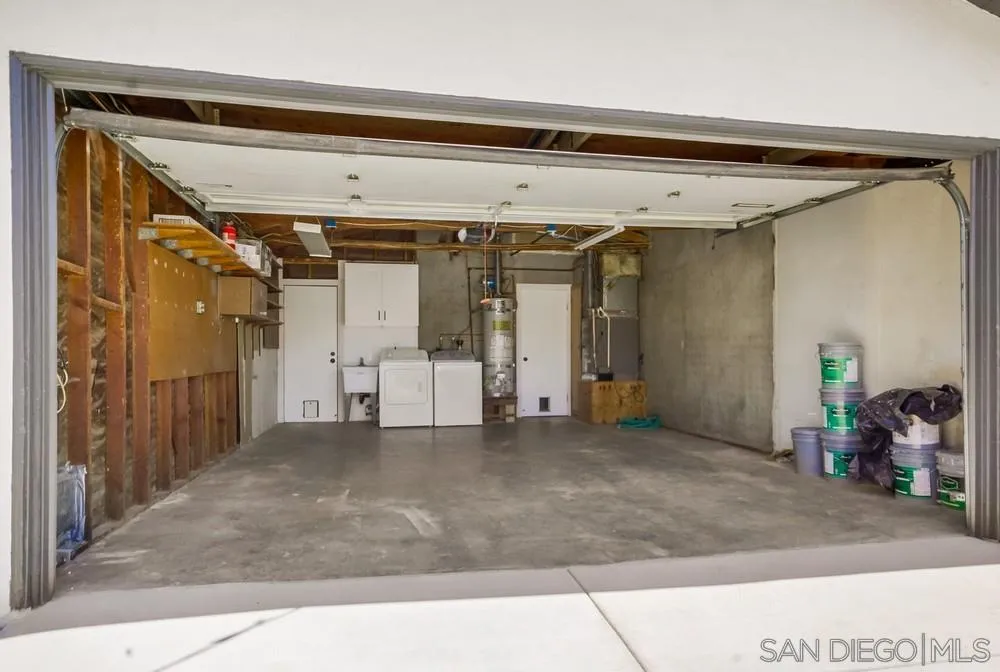 9841 Settle Road Santee, CA 92071 - Photo 46 of 46 a view of a hallway with wooden floor and white walls