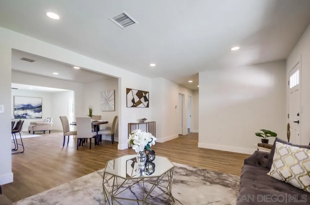 9841 Settle Road Santee, CA 92071 - Photo 9 of 46 a living room with furniture or couch and a dining table