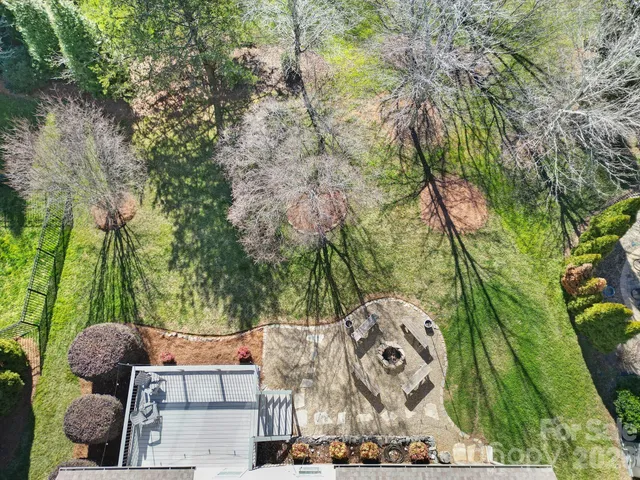 a view of yard from deck having outdoor seating