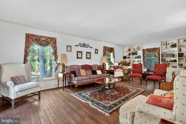a living room with furniture and a rug