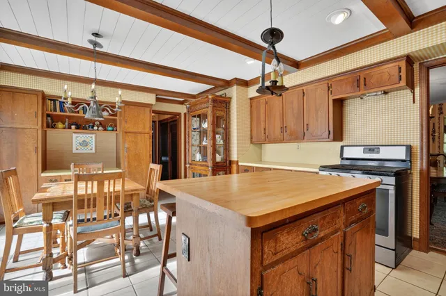 a kitchen with a table and chairs
