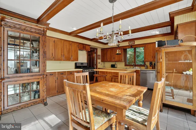 a view of a dining room with furniture wooden floor and chandelier