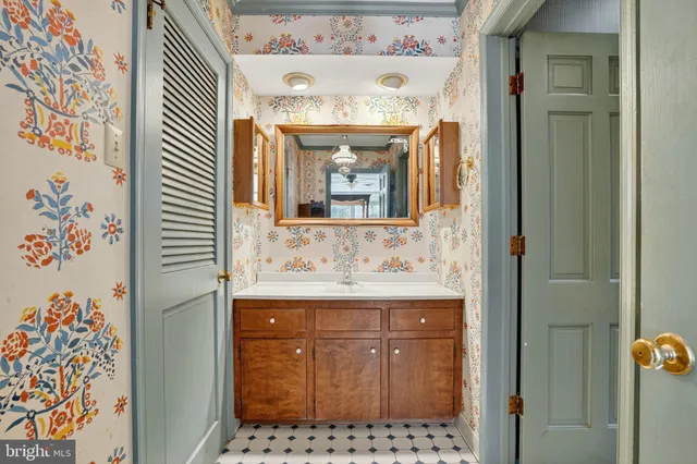 a bathroom with a sink and a mirror