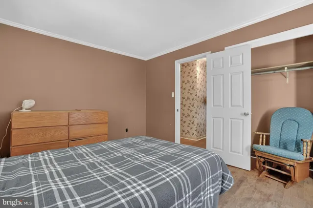 a bedroom with a bed and a cabinets