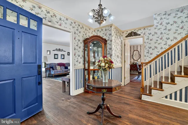 a view of hall way with furniture