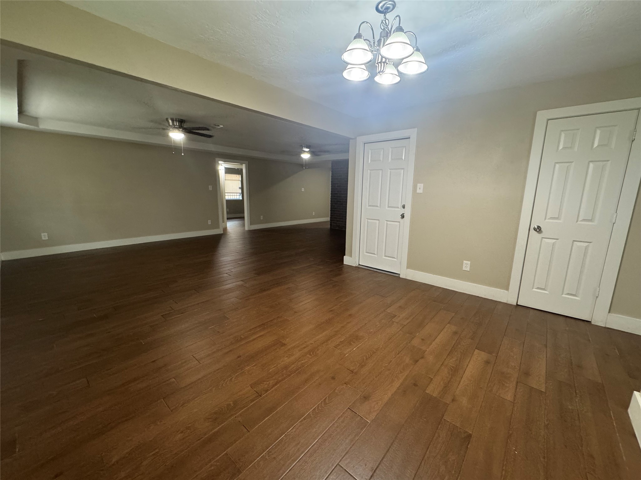 12811 Labelle Lane Houston, TX 77015 - Photo 4 of 14 wooden floor in an empty room with a window