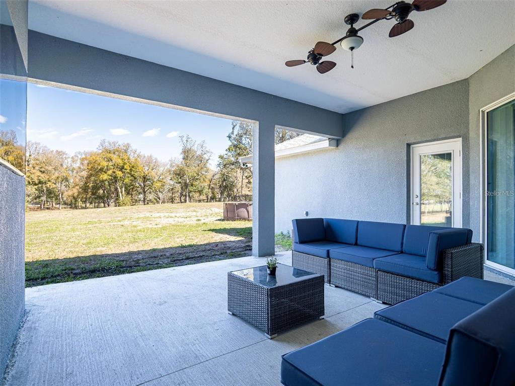 10688 Southwest 129th Terrace Road Dunnellon, FL 34432 - Photo 33 of 35 a living room with furniture and a large window