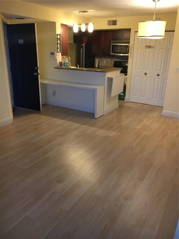 5152 Conroy Road, Unit 1314 Orlando, FL 32811 - Photo 5 of 9 a view of a kitchen with a sink