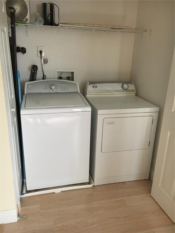 5152 Conroy Road, Unit 1314 Orlando, FL 32811 - Photo 8 of 9 a utility room with dryer and washer