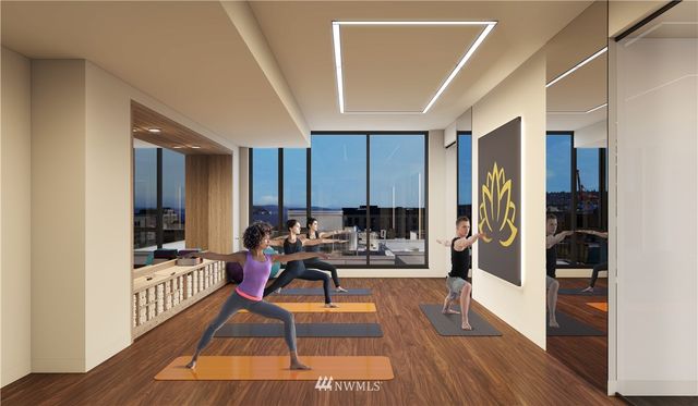 a living room filled with furniture and a wooden floor