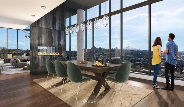 a living room with fireplace furniture and a large window