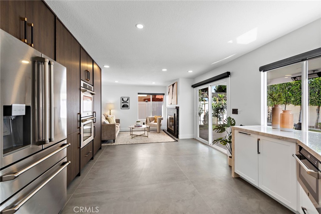 11 Bayside Irvine, CA 92614 - Photo 14 of 37 a large white kitchen with lots of counter top space