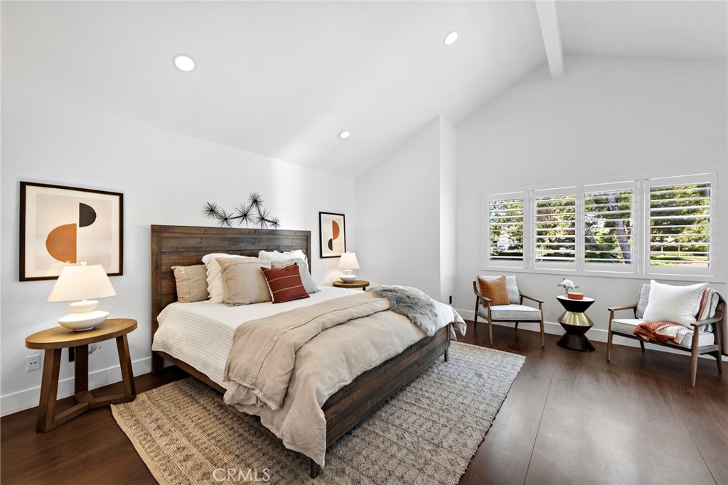 11 Bayside Irvine, CA 92614 - Photo 25 of 37 a bedroom with a bed and wooden floor